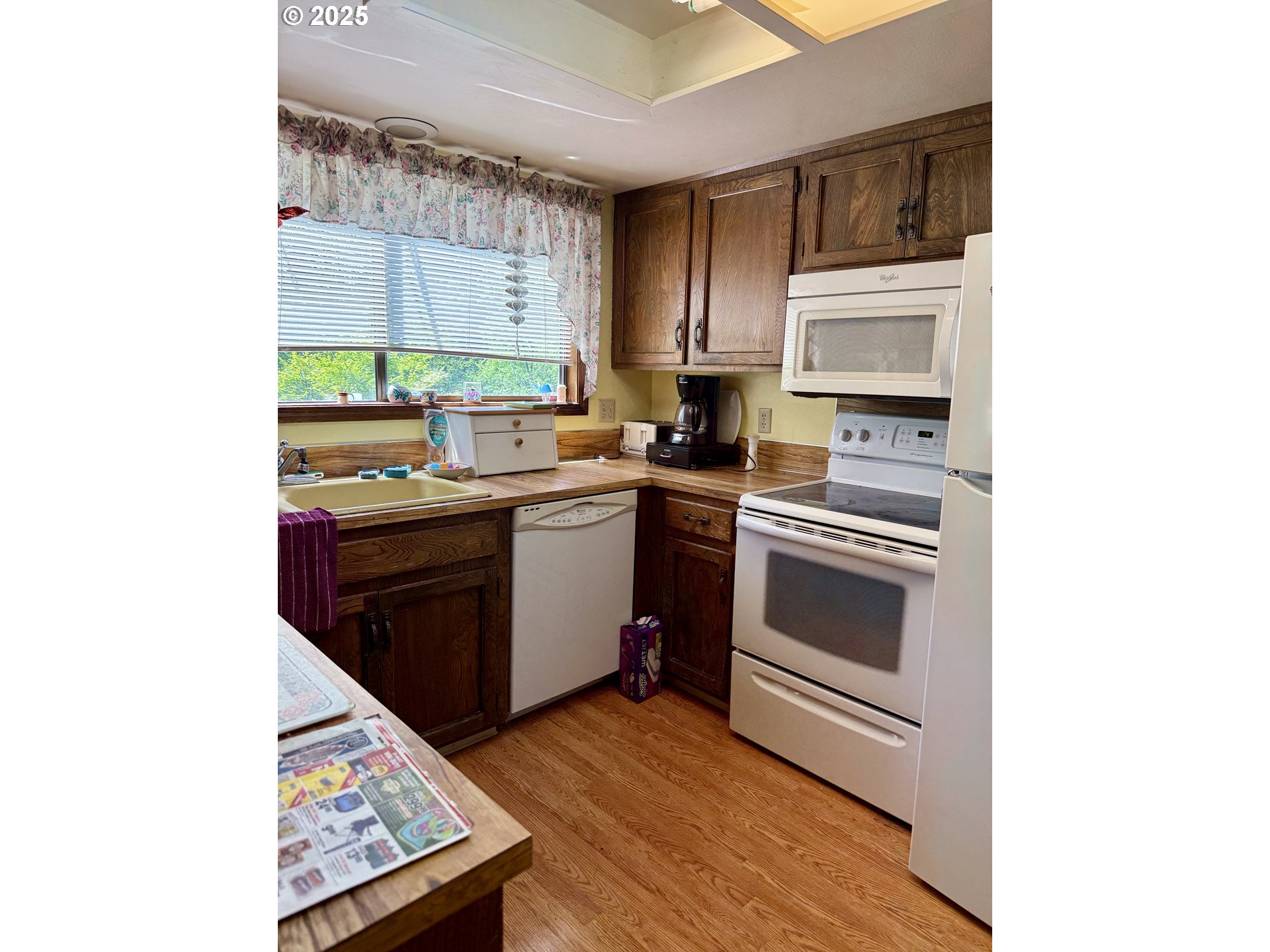 275 Northeast Scott Drive Gresham, OR 97030 - Photo 15 of 27 a kitchen with a sink cabinets and stainless steel appliances