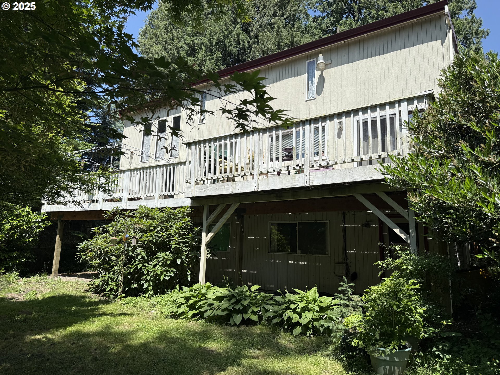 275 Northeast Scott Drive Gresham, OR 97030 - Photo 5 of 27 a front view of a house with a yard