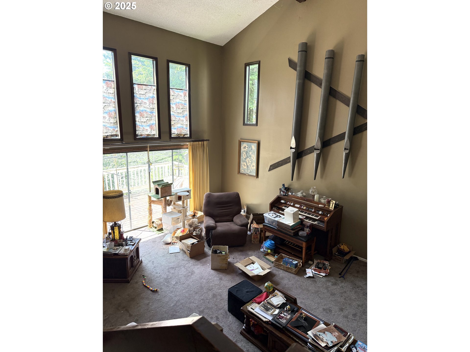 275 Northeast Scott Drive Gresham, OR 97030 - Photo 10 of 27 a living room with furniture and a floor to ceiling window