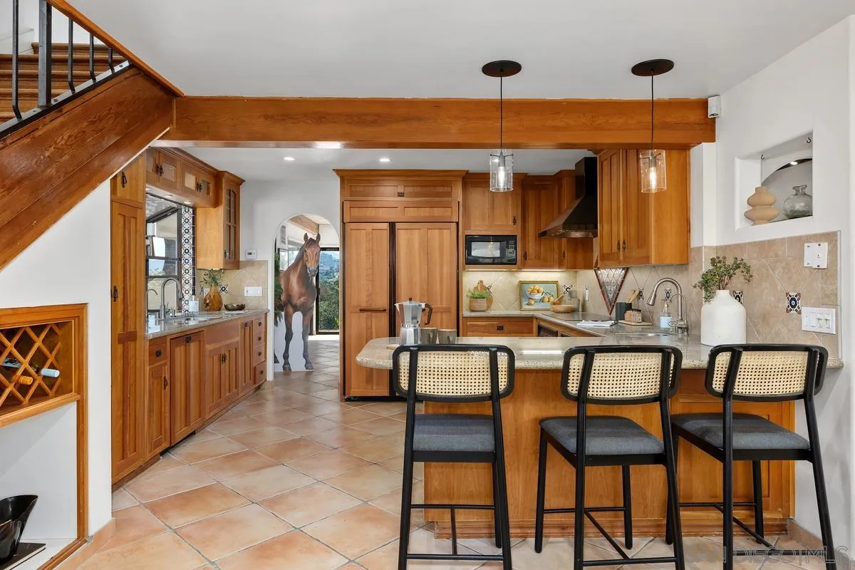 974 Via Hillview Fallbrook, CA 92028 - Photo 5 of 43 a dining area with a table and chairs