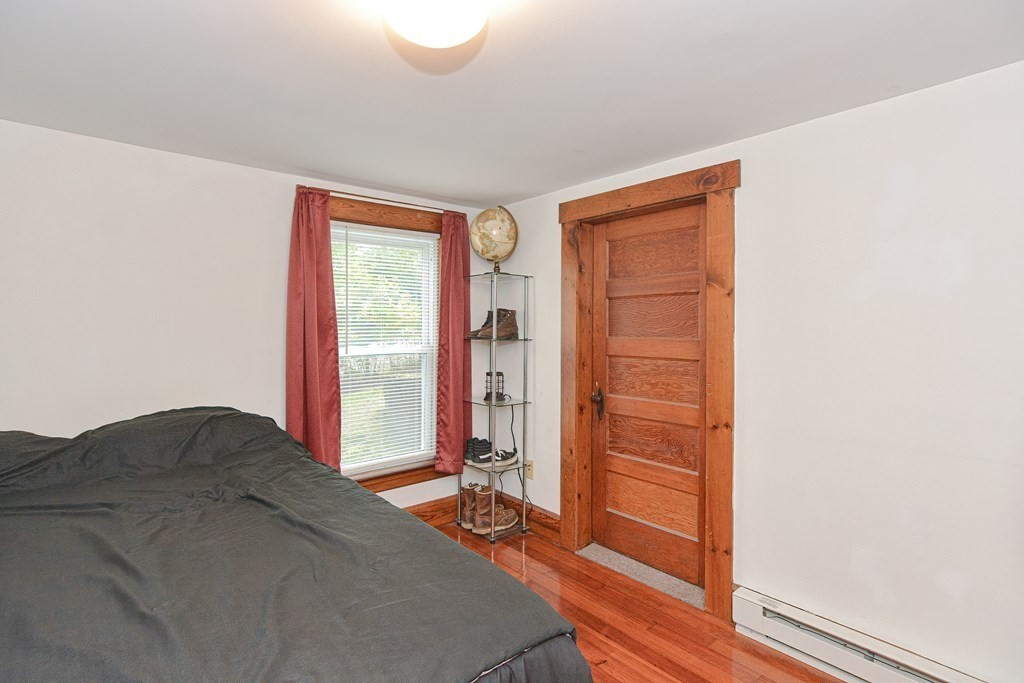 342 Providence Road Grafton, MA 01560 - Photo 37 of 40 a bedroom with a bed and a window