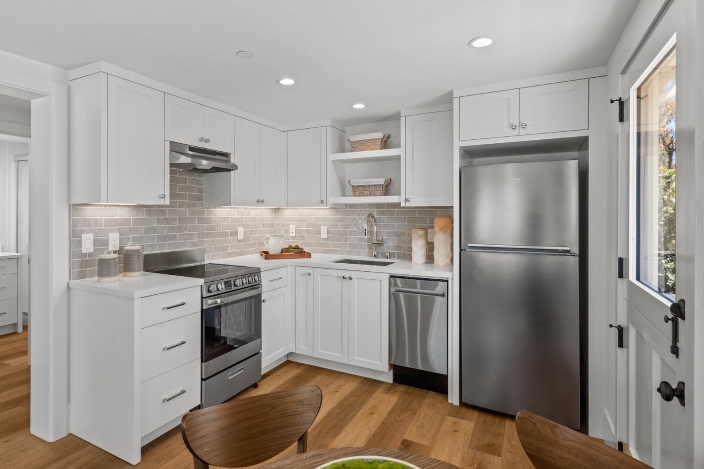 2108 Cully Place San Jose, CA 95124 - Photo 28 of 35 a kitchen with a refrigerator stove and white cabinets