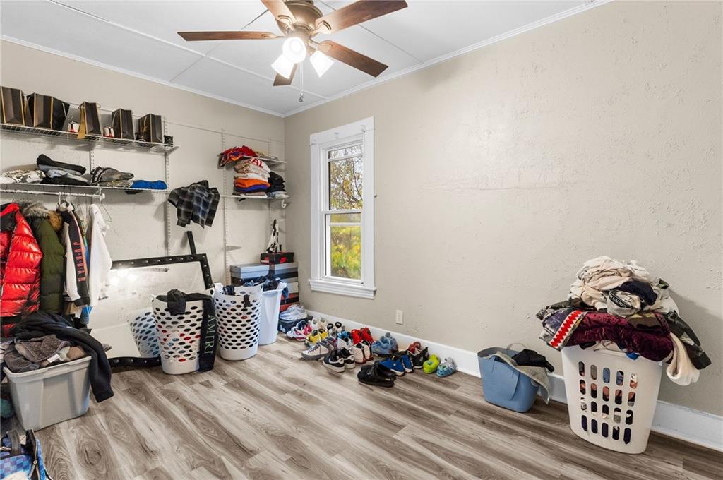 282 Orchard Street Sharon, PA 16146 - Photo 11 of 17 a bedroom with furniture a chandelier and a window