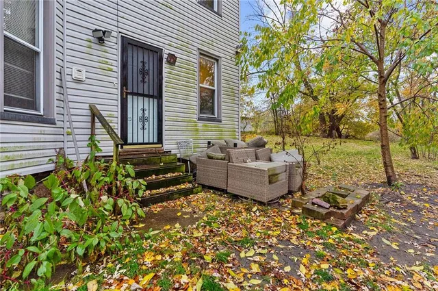 a view of a couches in backyard of house