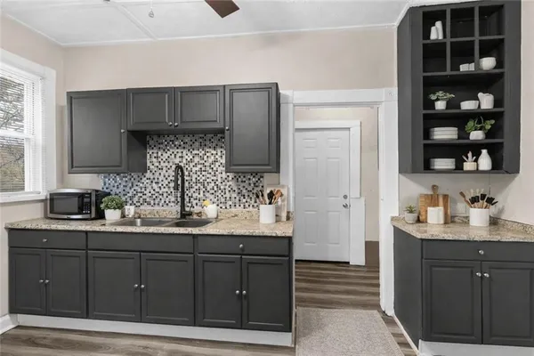 a kitchen with a sink and cabinets