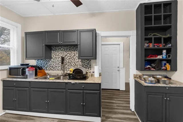 a kitchen with stainless steel appliances a stove and cabinets