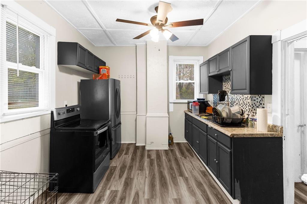 282 Orchard Street Sharon, PA 16146 - Photo 7 of 17 a kitchen with stainless steel appliances a stove refrigerator and microwave