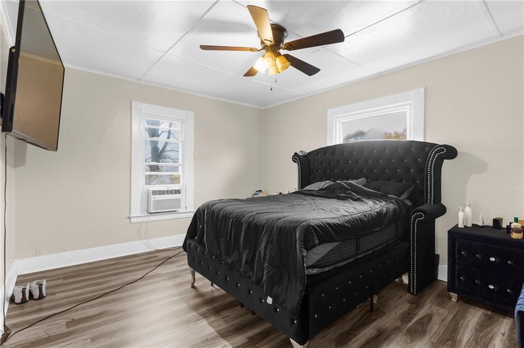 282 Orchard Street Sharon, PA 16146 - Photo 9 of 16 a bedroom with a bed and a window