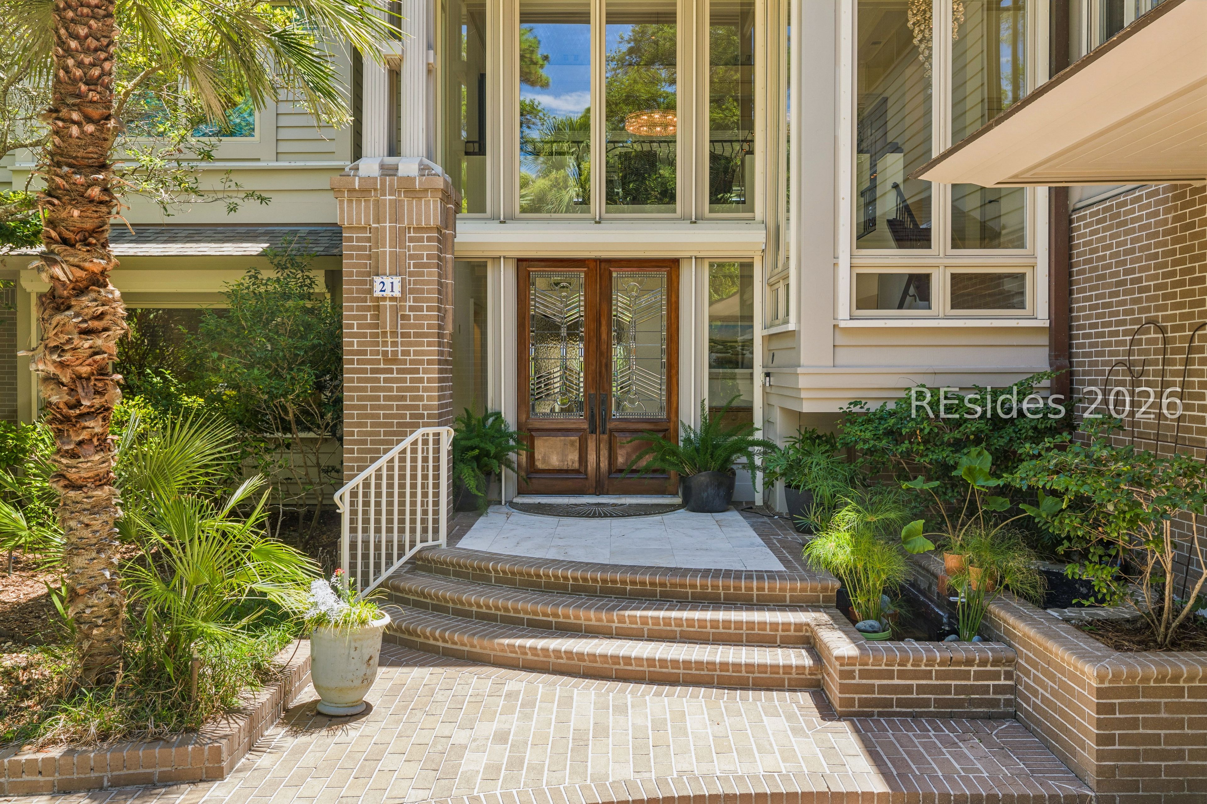 21 Red Cardinal Road Hilton Head Island, SC 29928 - Photo 3 of 54 Expansive windows and a Koi pond welcome