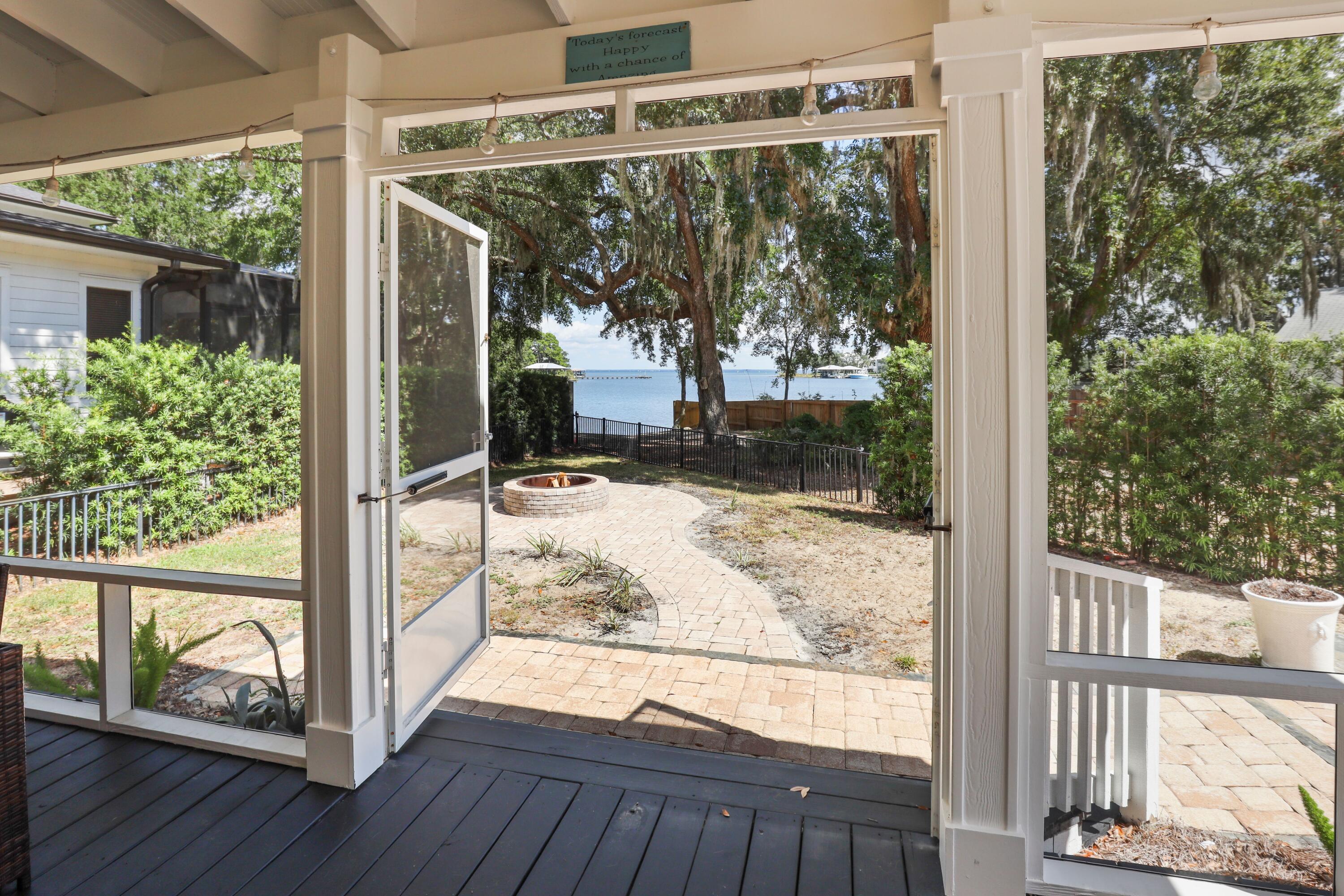 159 Beacon Point Drive Santa Rosa Beach, FL 32459 - Photo 12 of 57 a view of a porch with wooden floor and outdoor space