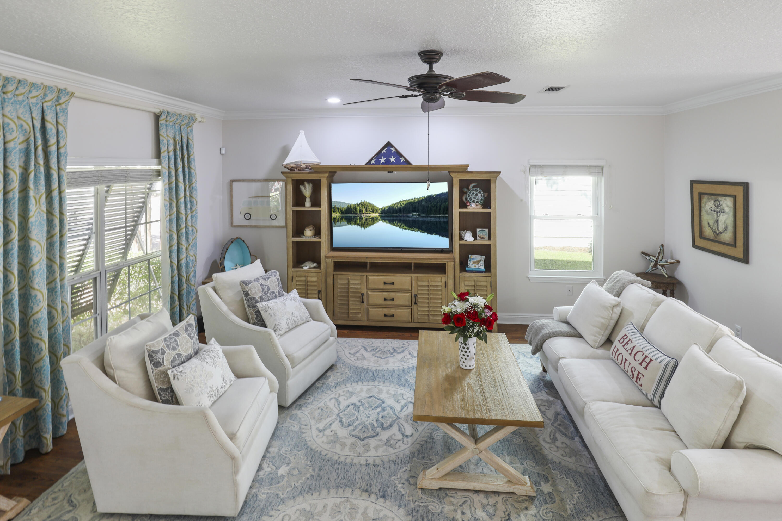 159 Beacon Point Drive Santa Rosa Beach, FL 32459 - Photo 16 of 57 a living room with furniture and a flat screen tv