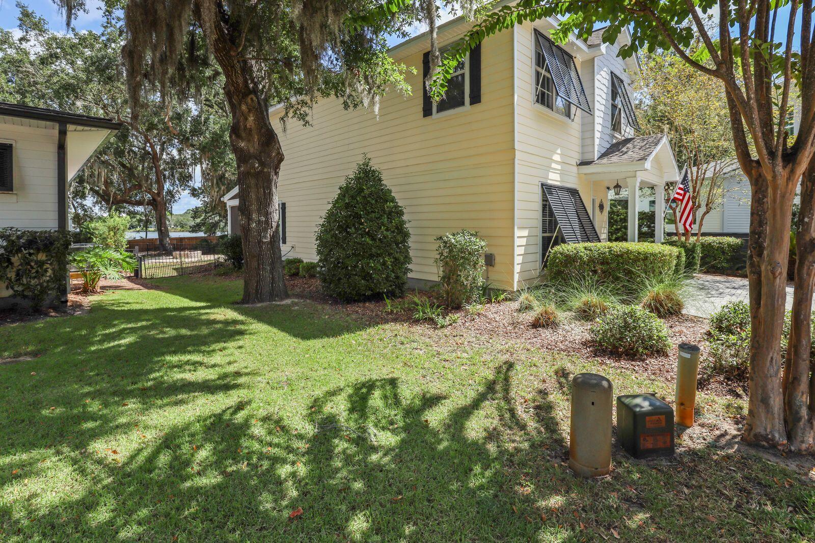 159 Beacon Point Drive Santa Rosa Beach, FL 32459 - Photo 27 of 57 a backyard of a house with fountain and barbeque oven