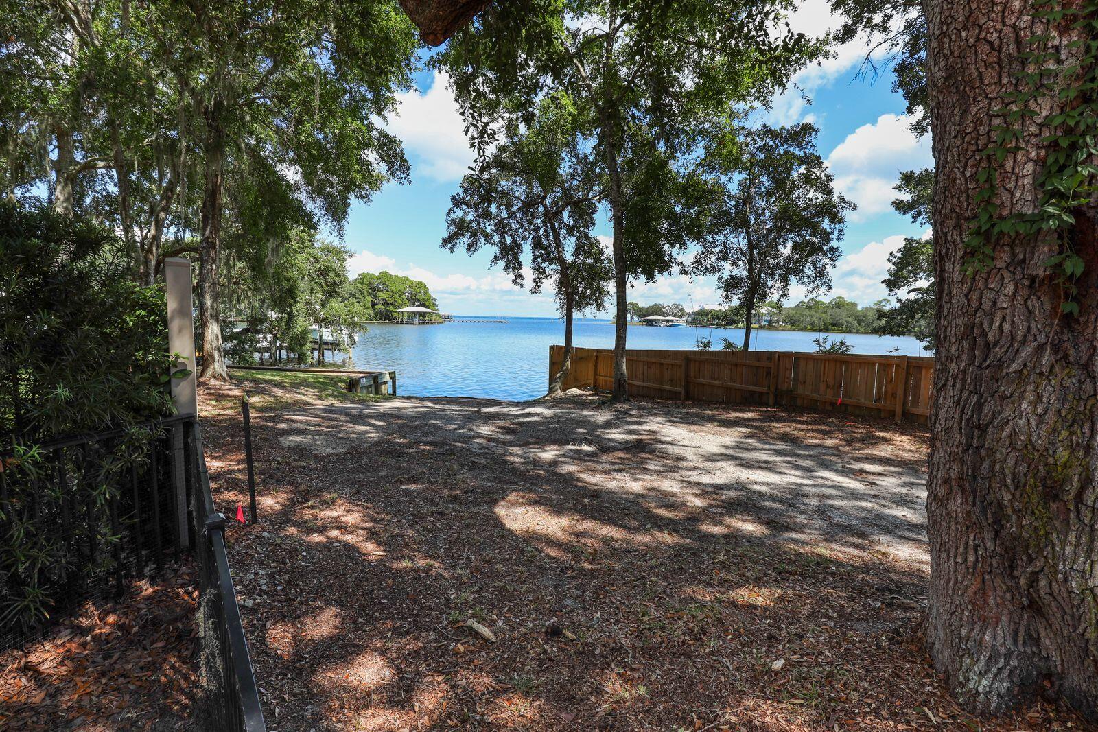 159 Beacon Point Drive Santa Rosa Beach, FL 32459 - Photo 30 of 57 a view of a yard with plants and trees