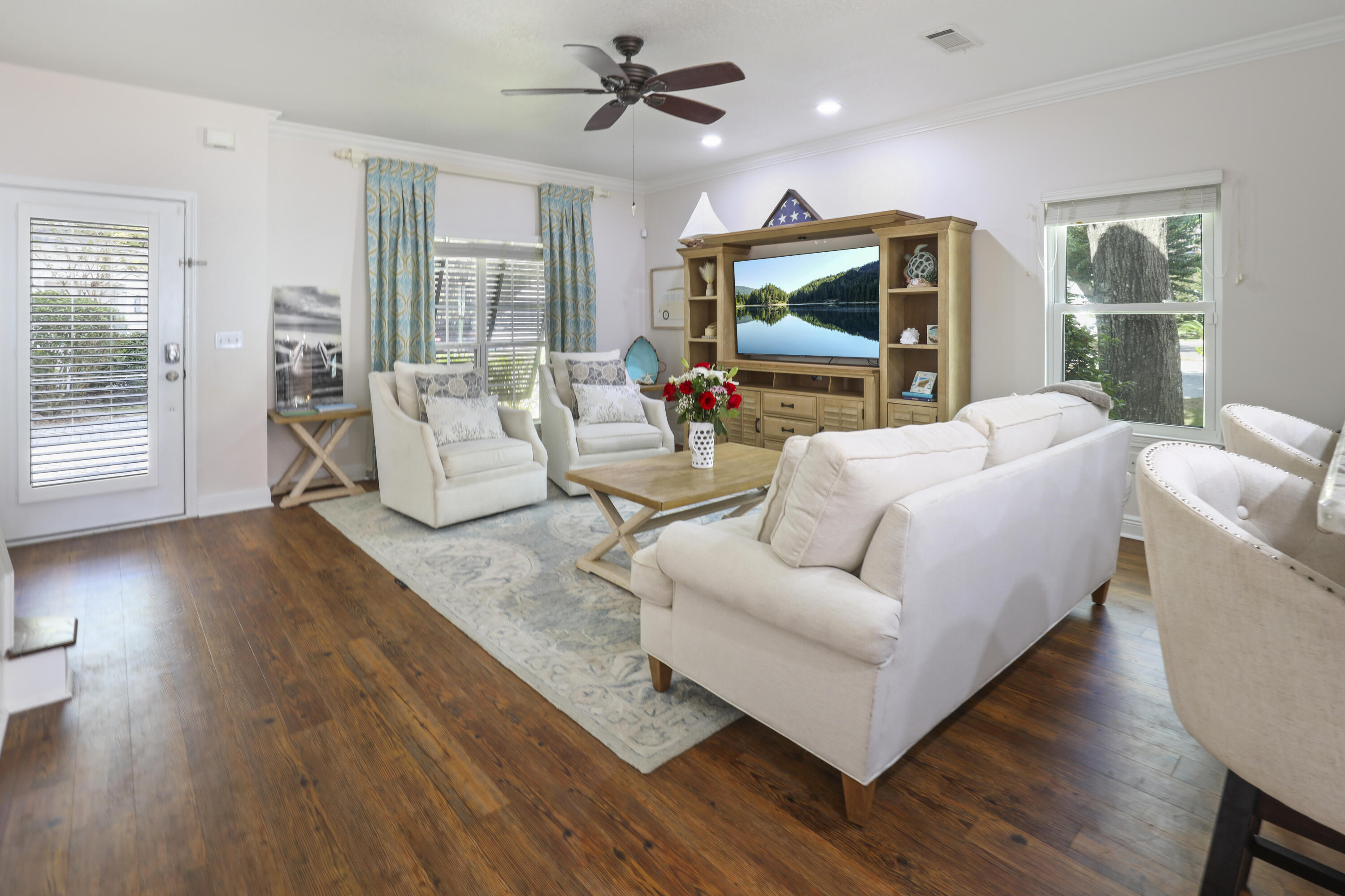 159 Beacon Point Drive Santa Rosa Beach, FL 32459 - Photo 32 of 57 a living room with furniture and a flat screen tv