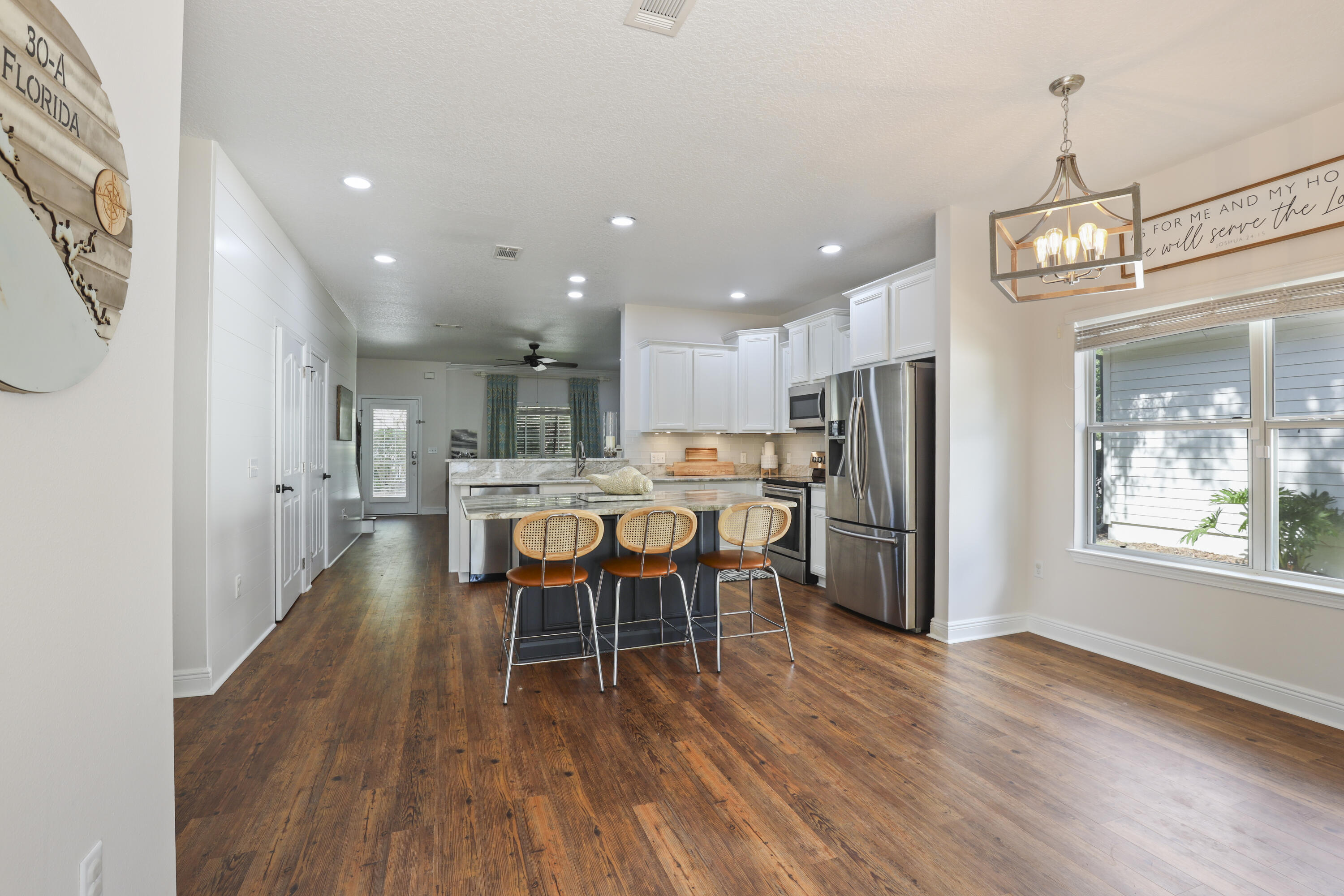159 Beacon Point Drive Santa Rosa Beach, FL 32459 - Photo 36 of 57 a view of a dining room with furniture window and wooden floor