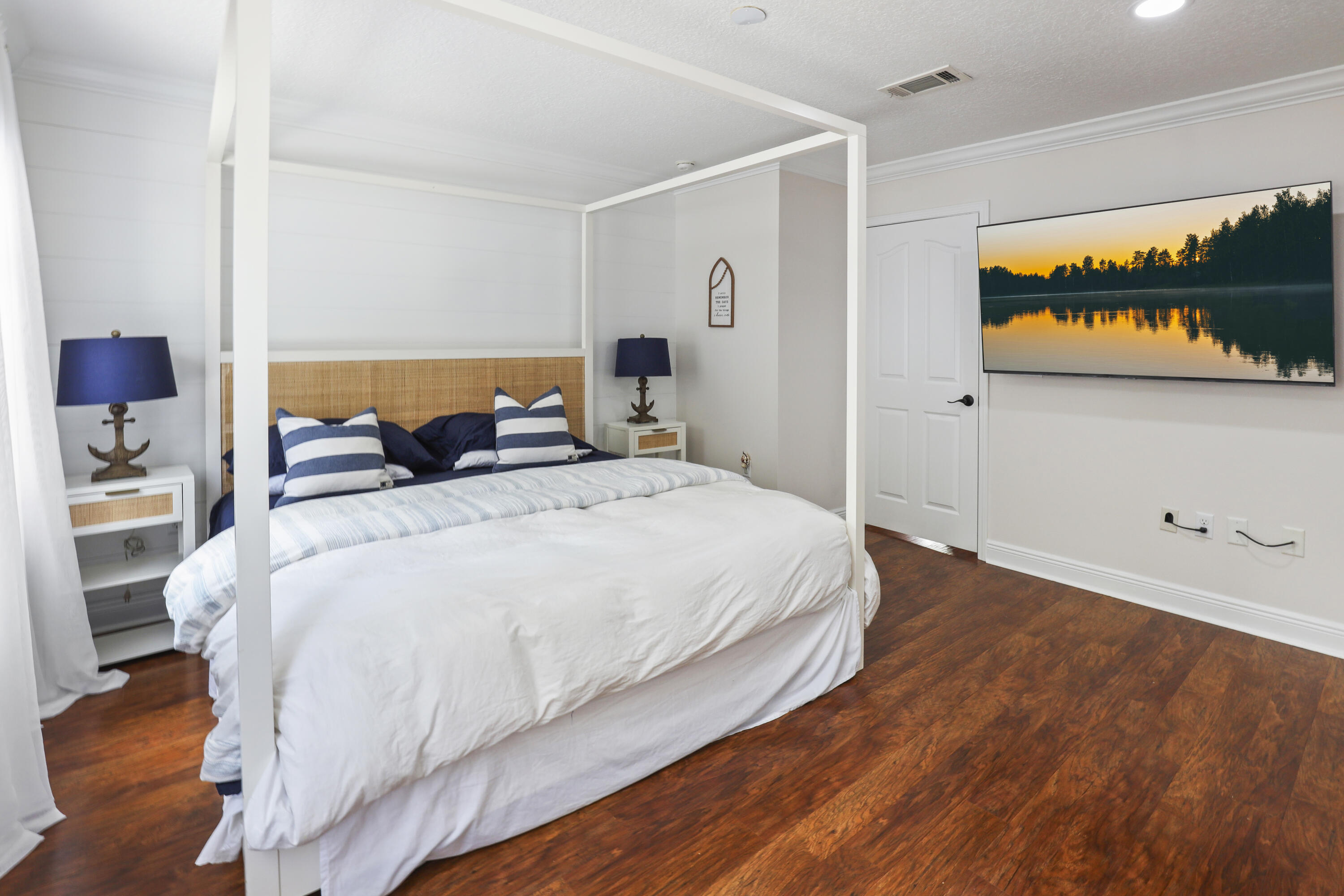 159 Beacon Point Drive Santa Rosa Beach, FL 32459 - Photo 42 of 57 a bedroom with a bed and a painting on the wall