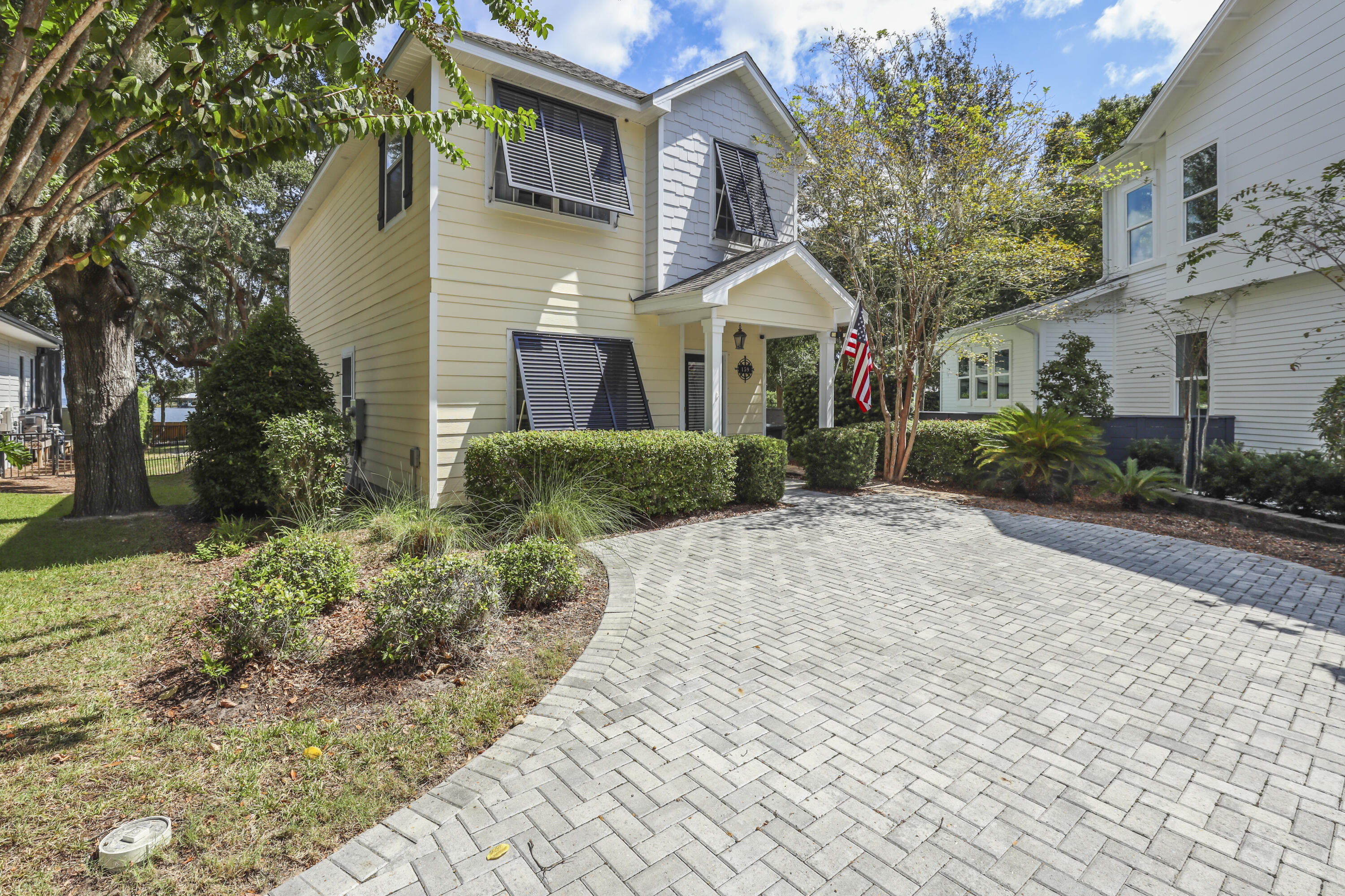 159 Beacon Point Drive Santa Rosa Beach, FL 32459 - Photo 7 of 57 a front view of a house with garden