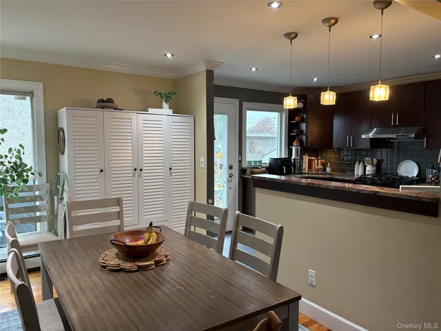 a kitchen with a table and chairs in it