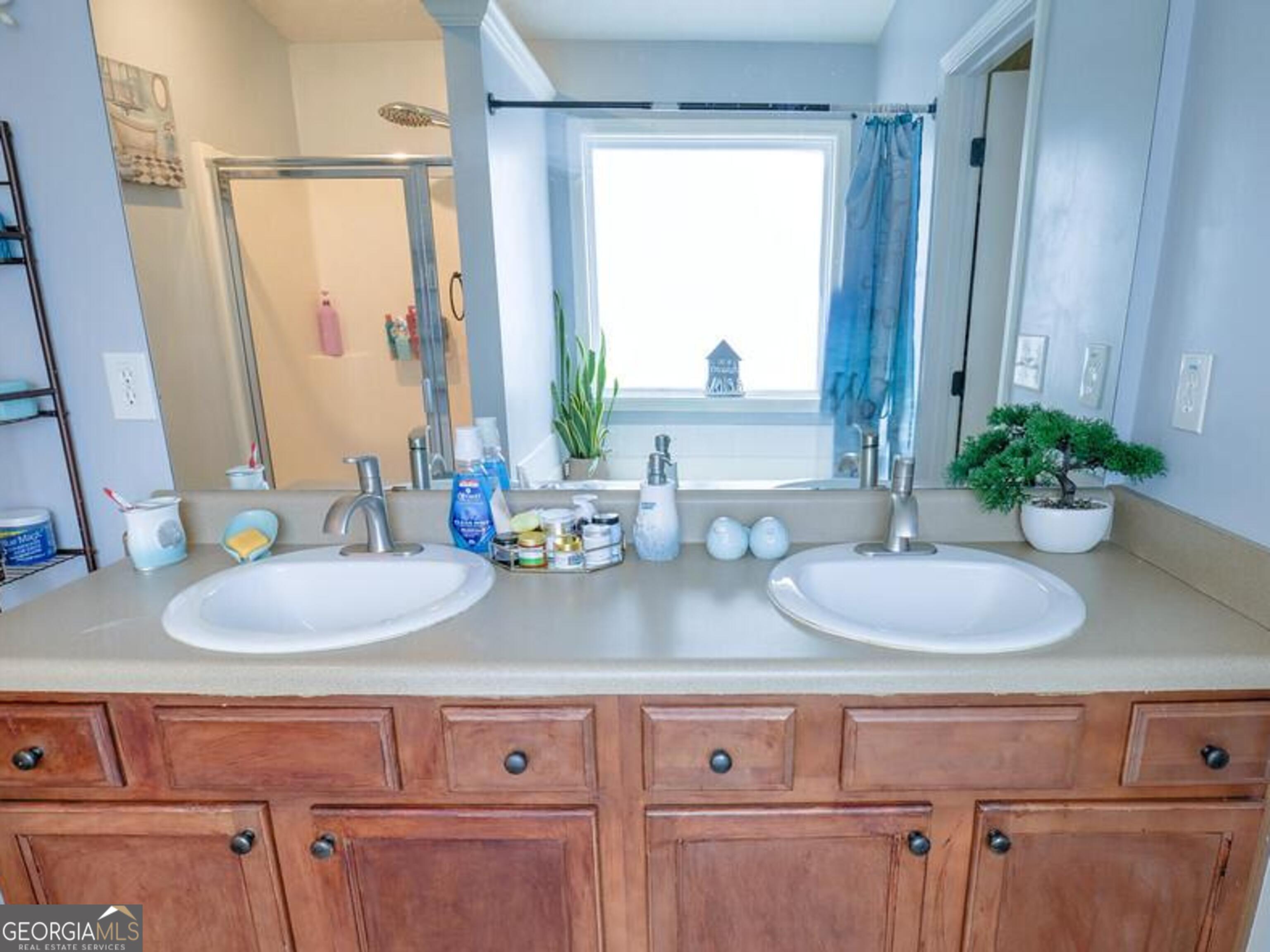 1513 Pointe S Circle Bethlehem, GA 30620 - Photo 13 of 22 a bathroom with a granite countertop sink and a mirror