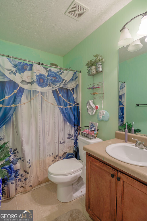 1513 Pointe S Circle Bethlehem, GA 30620 - Photo 16 of 22 a bathroom with a sink a toilet and mirror