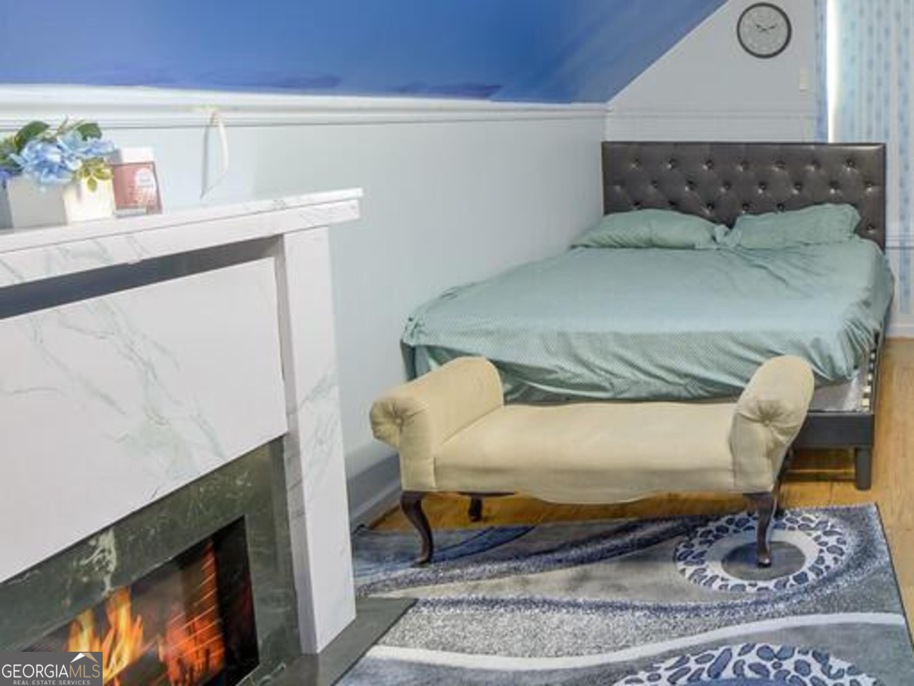 1513 Pointe S Circle Bethlehem, GA 30620 - Photo 18 of 22 a bed sitting in a bedroom with a rug