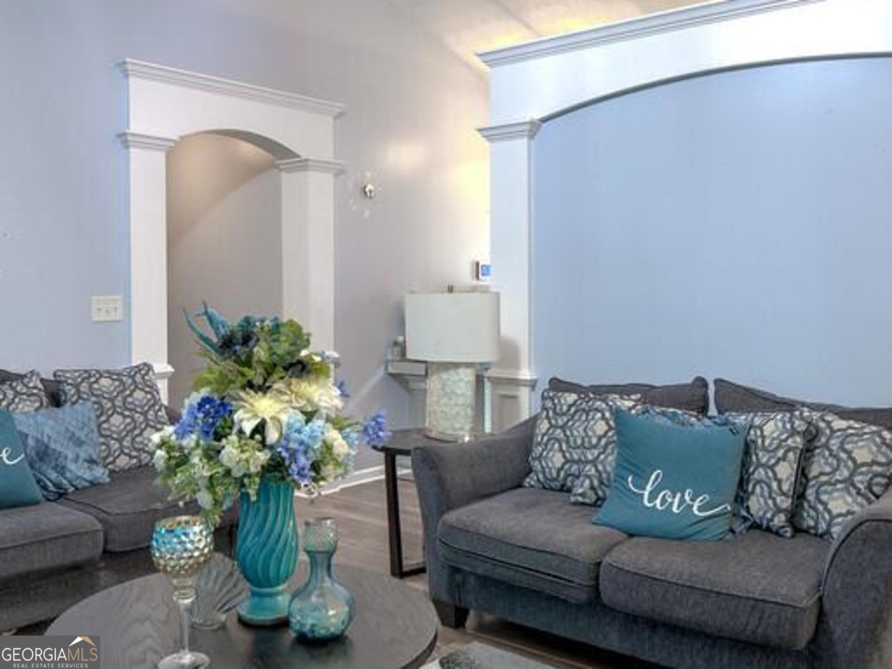 1513 Pointe S Circle Bethlehem, GA 30620 - Photo 5 of 22 a living room with furniture flowerpot and a potted plant