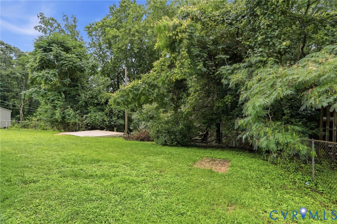 5301 Dalglish Road Richmond, VA 23223 - Photo 39 of 42 Expansive grass lawn featuring a concrete pad, mat