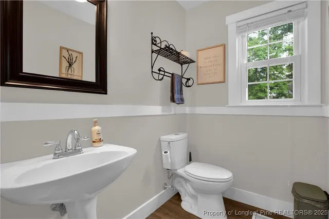 a view of a storage and utility room with washer and dryer
