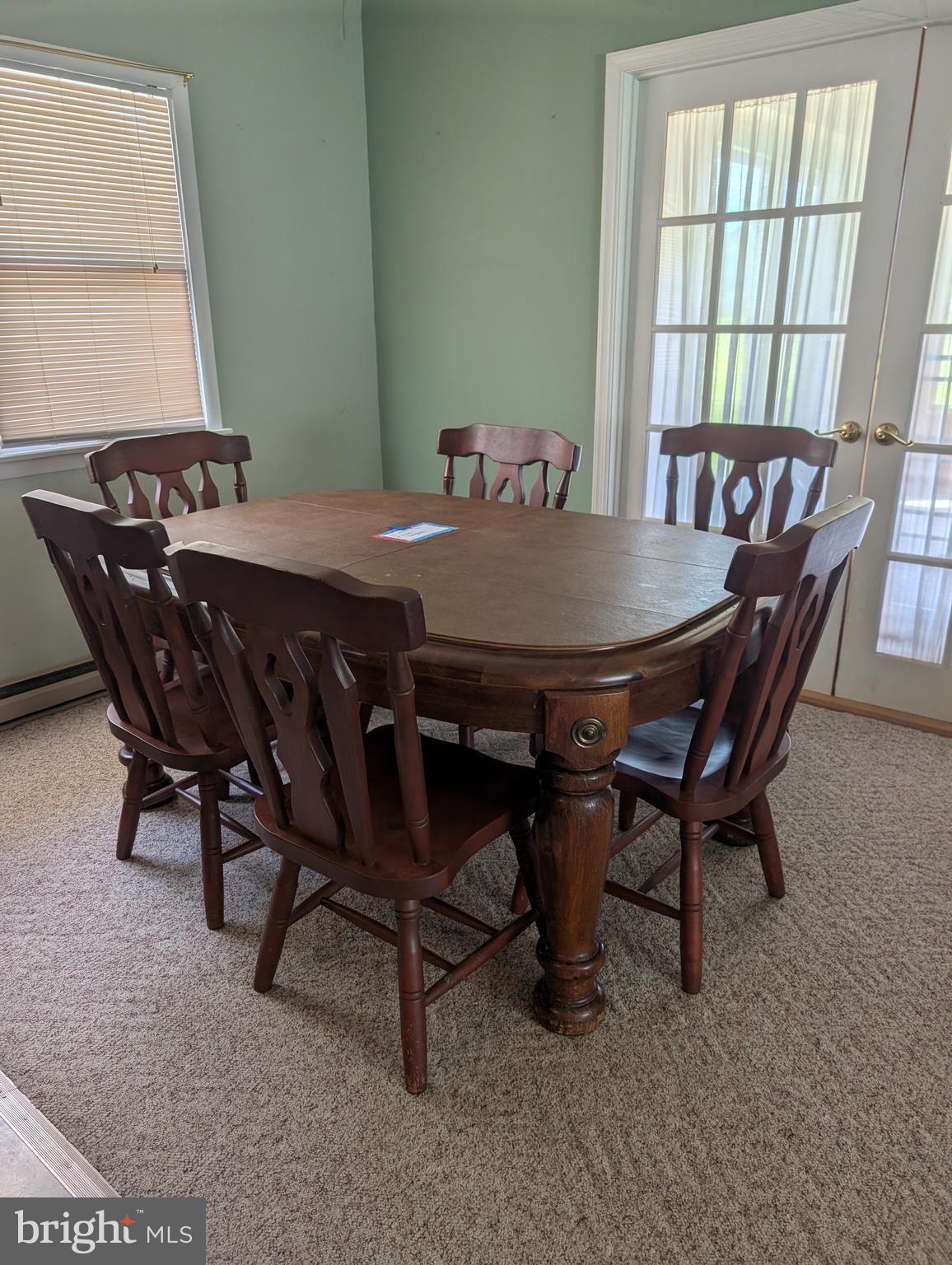 12615 Eveland Road Ridgely, MD 21660 - Photo 13 of 28 a view of a dining room with furniture and window