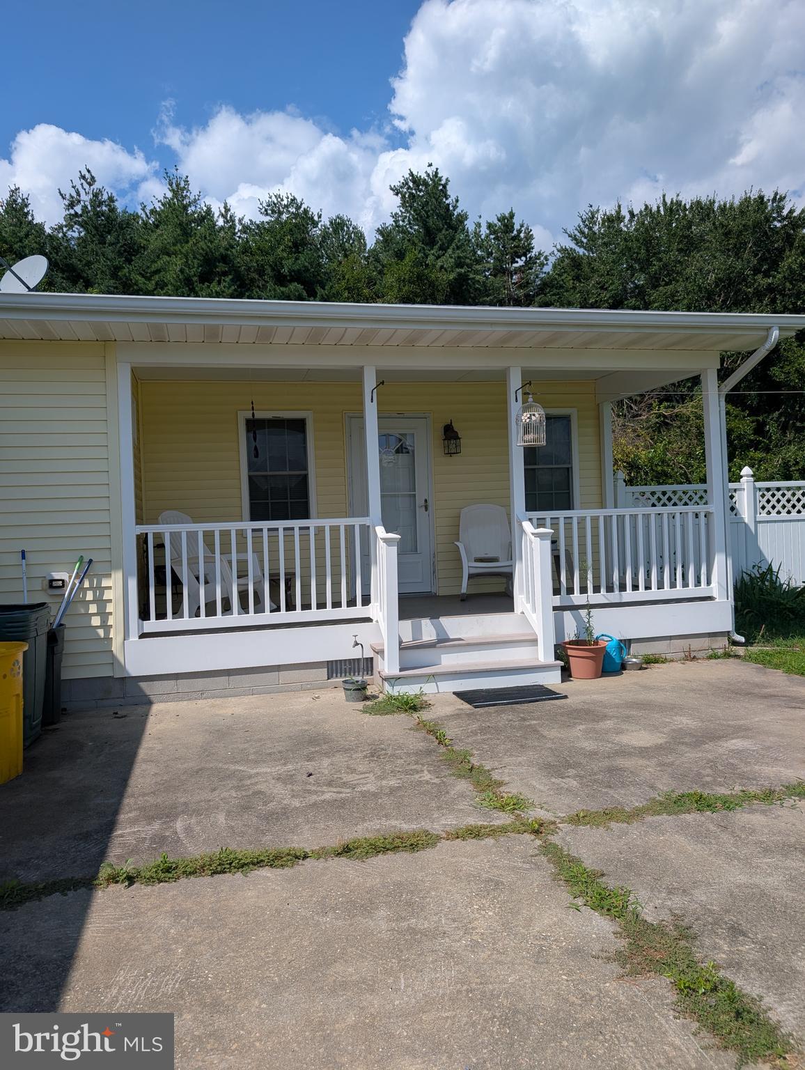 12615 Eveland Road Ridgely, MD 21660 - Photo 17 of 28 a view of a house with a floor to ceiling window and a yard