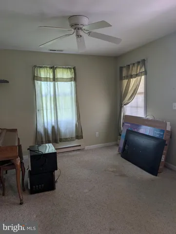 a room with window and furniture