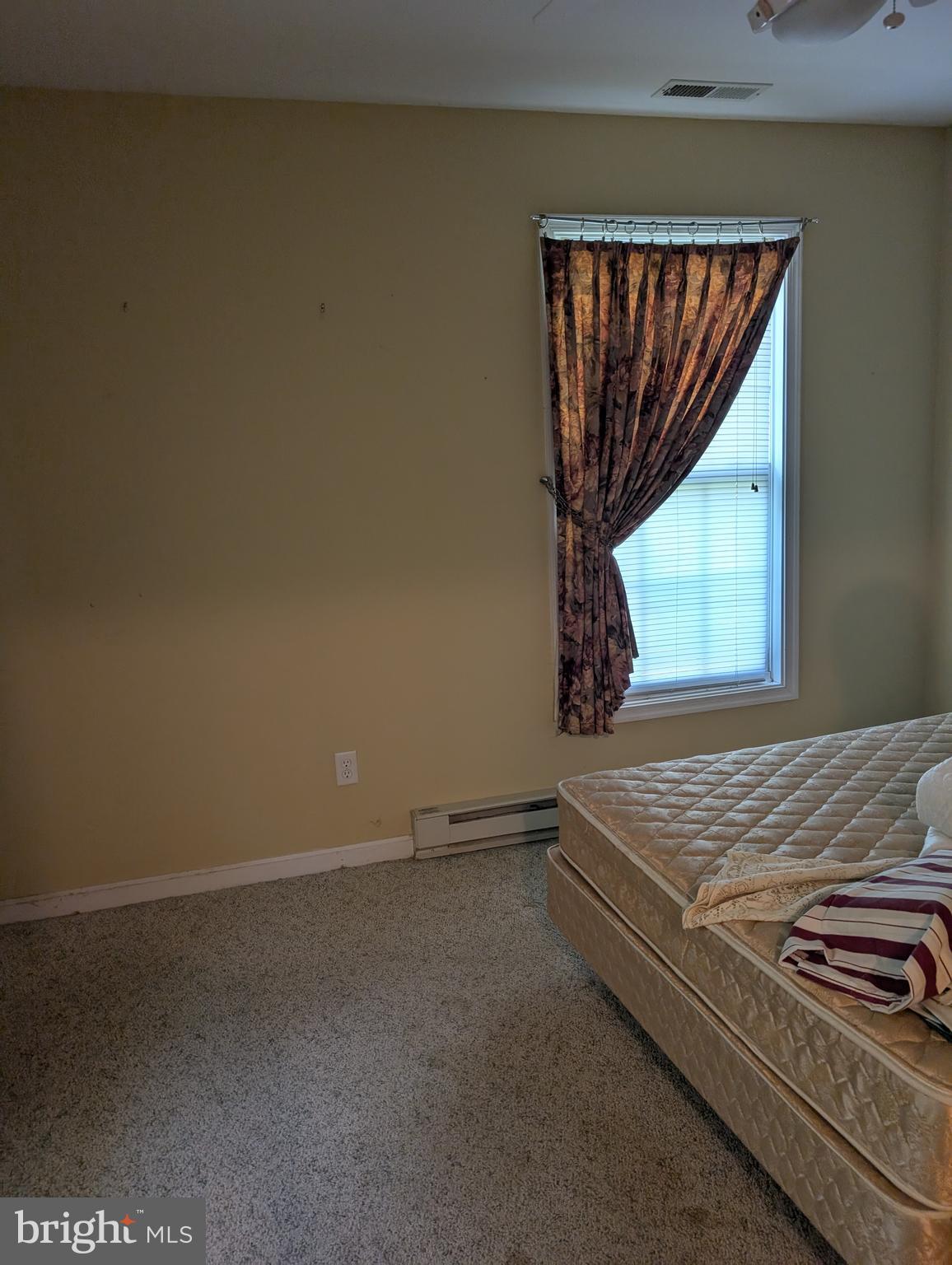 12615 Eveland Road Ridgely, MD 21660 - Photo 20 of 28 a view of a room with exposed radiator and window