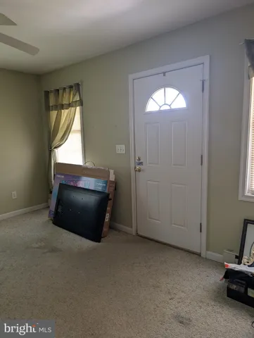 a room with a mirror and a window