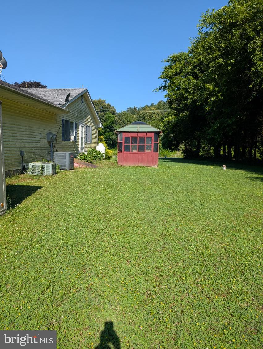 12615 Eveland Road Ridgely, MD 21660 - Photo 26 of 28 a front view of a house with garden