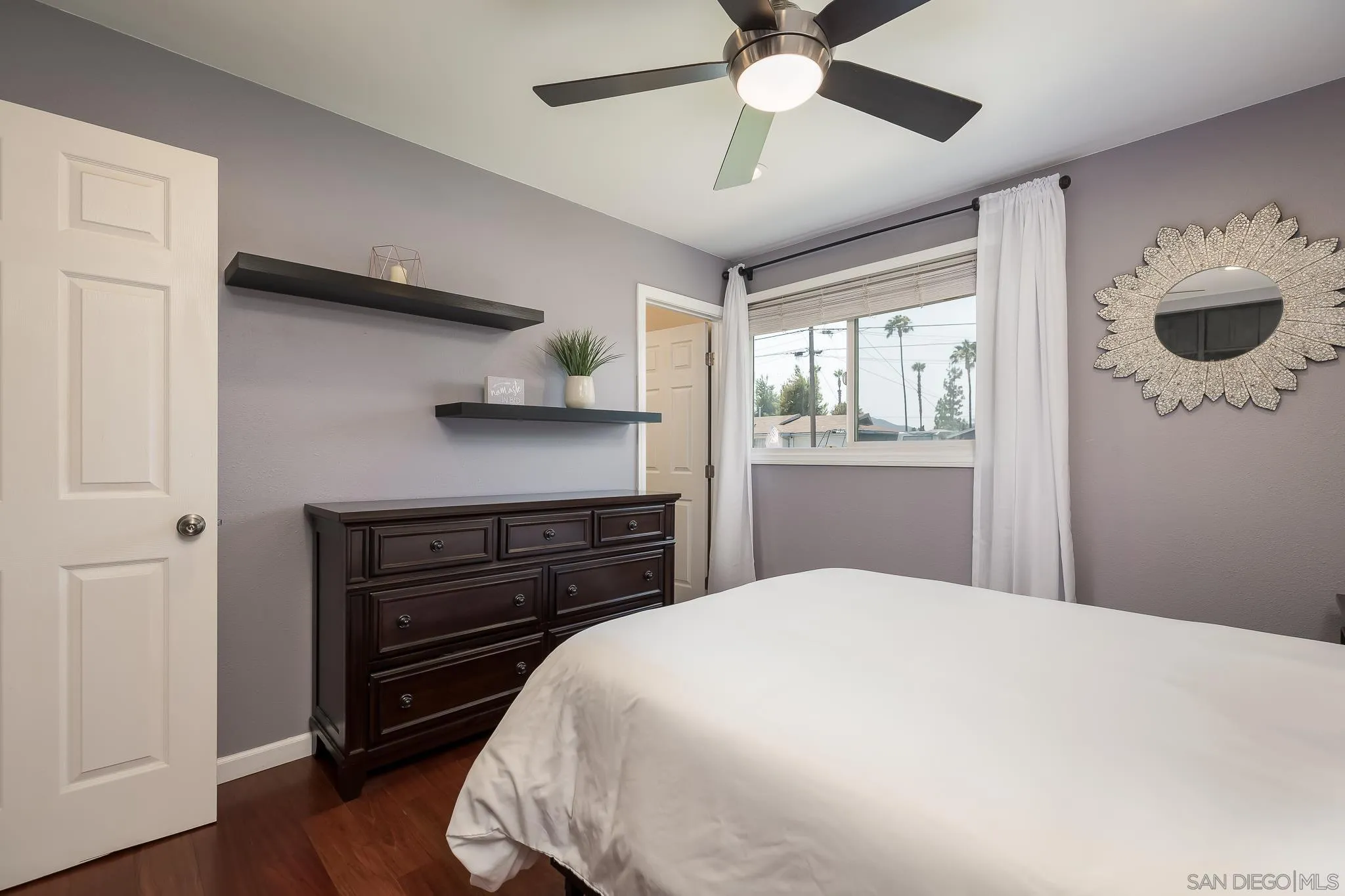 9731 Domer Road Santee, CA 92071 - Photo 15 of 32 a bedroom with a bed and a window