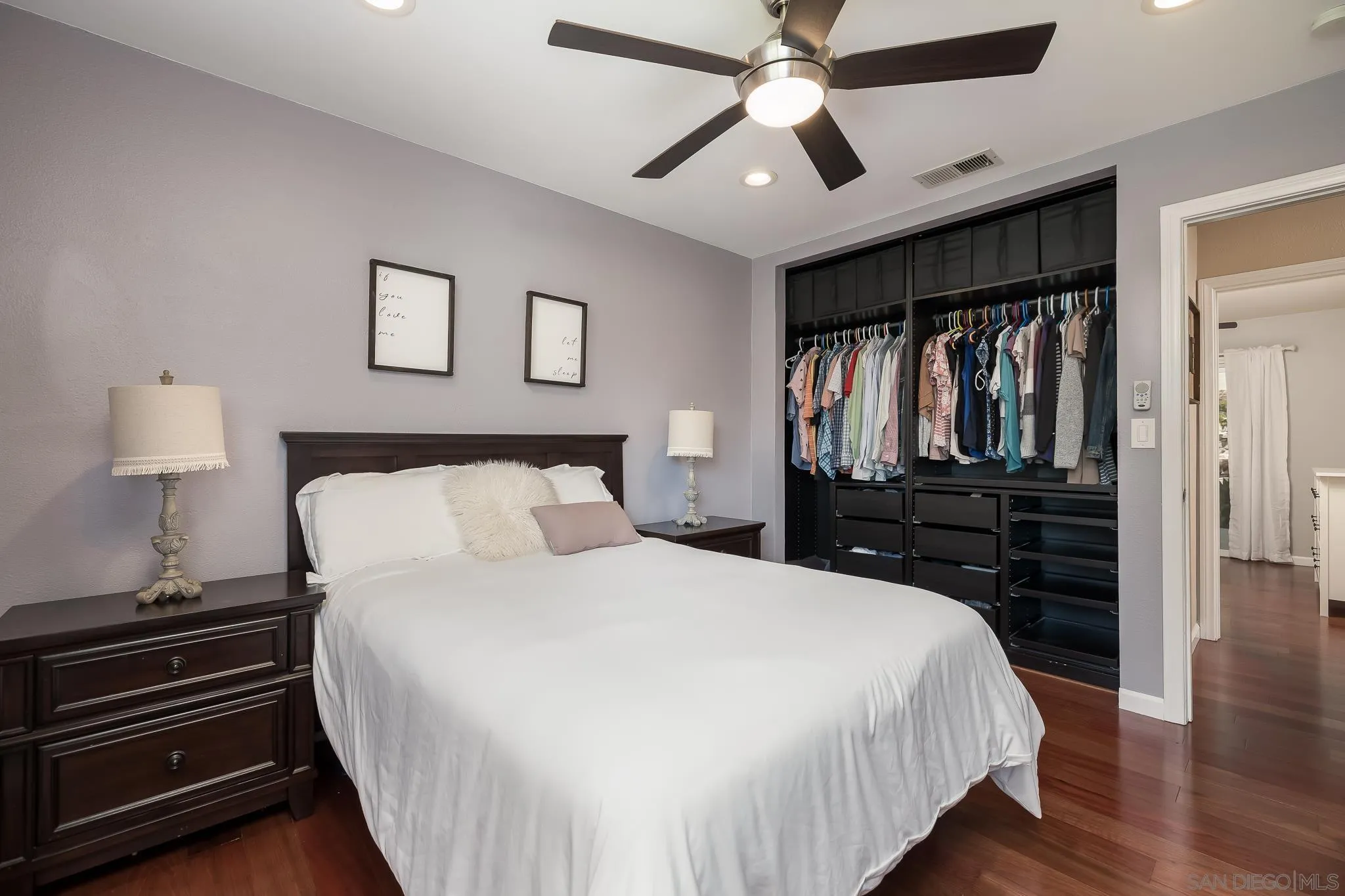 9731 Domer Road Santee, CA 92071 - Photo 16 of 32 a bedroom with a bed and a chandelier