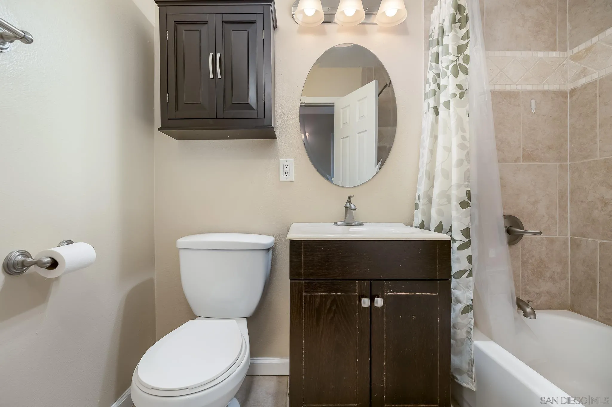 9731 Domer Road Santee, CA 92071 - Photo 18 of 32 a bathroom with a sink a toilet and shower