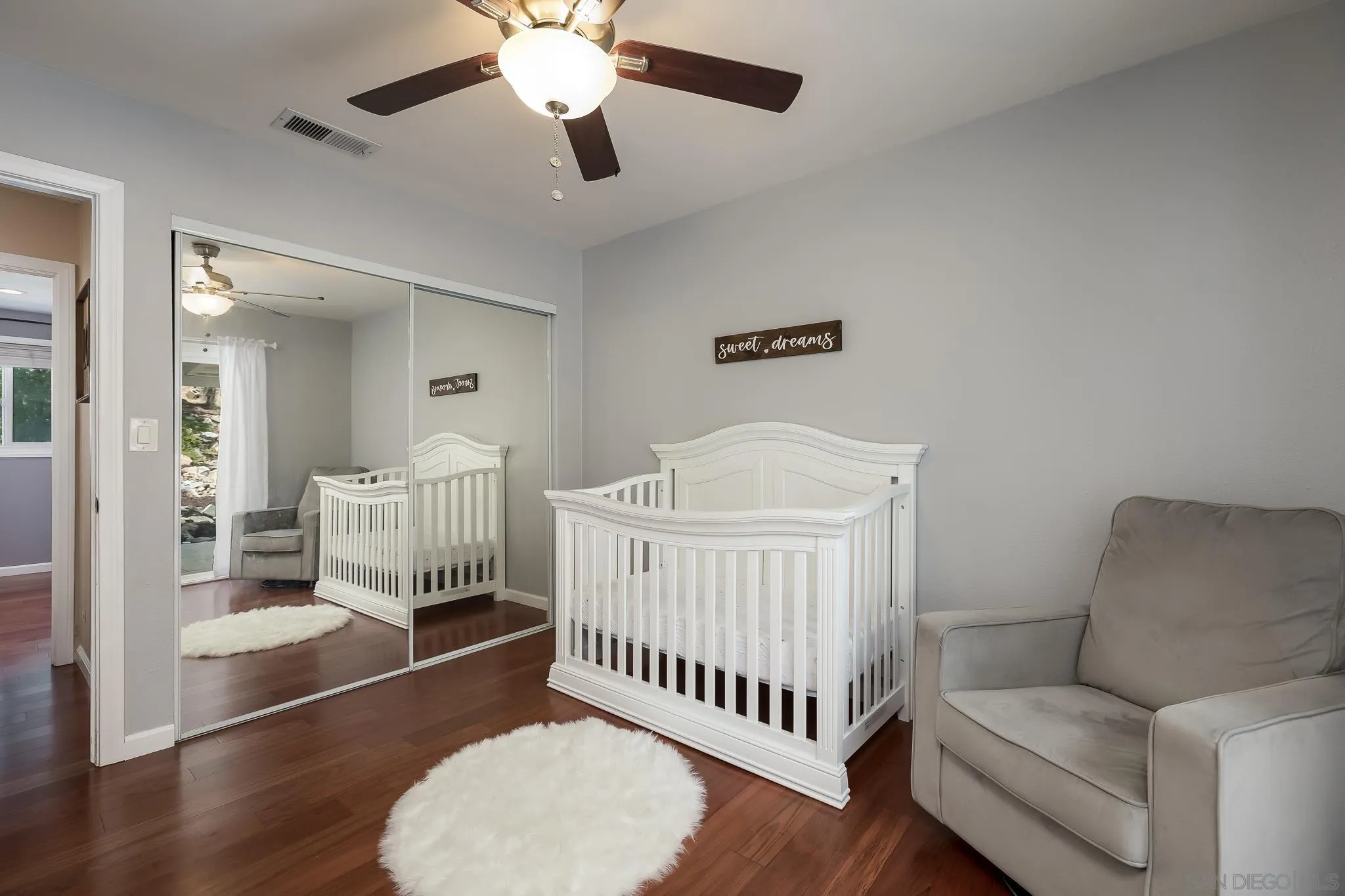 9731 Domer Road Santee, CA 92071 - Photo 20 of 32 a bedroom with furniture and wooden floor