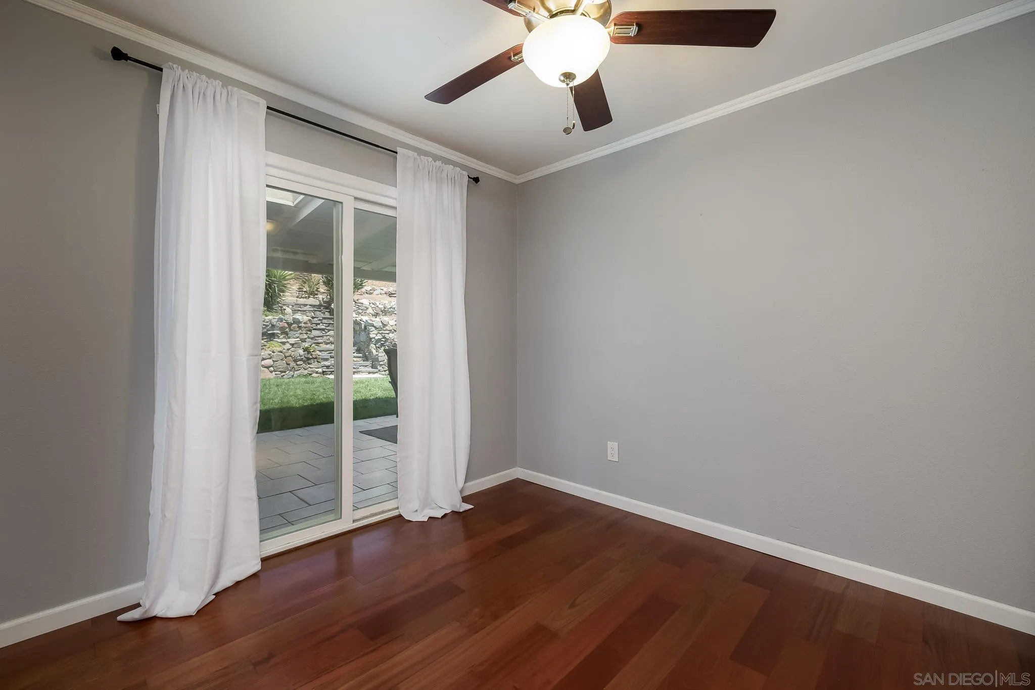 9731 Domer Road Santee, CA 92071 - Photo 21 of 32 an empty room with wooden floor and windows