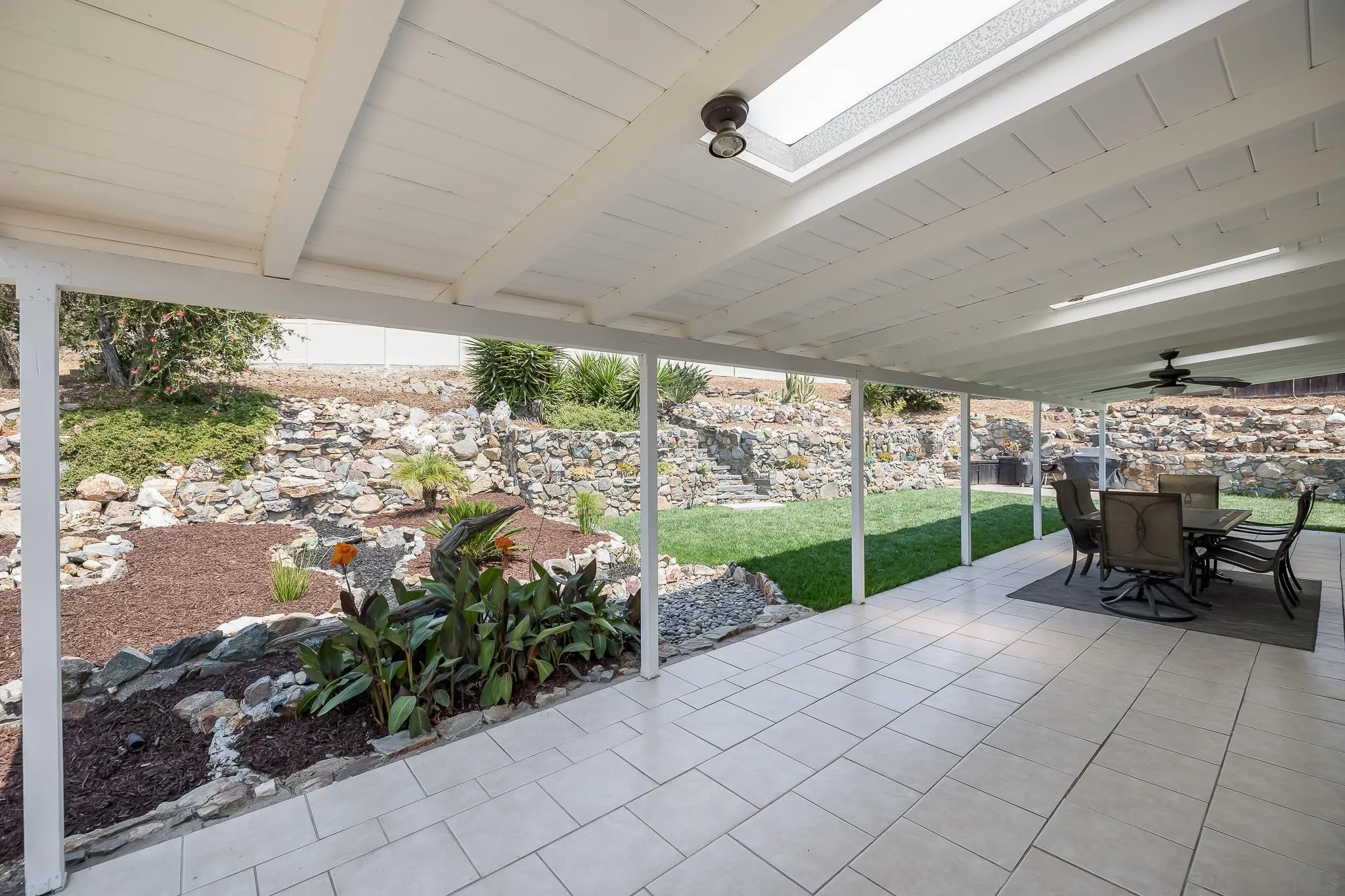 9731 Domer Road Santee, CA 92071 - Photo 23 of 32 a view of a porch with chairs and a yard