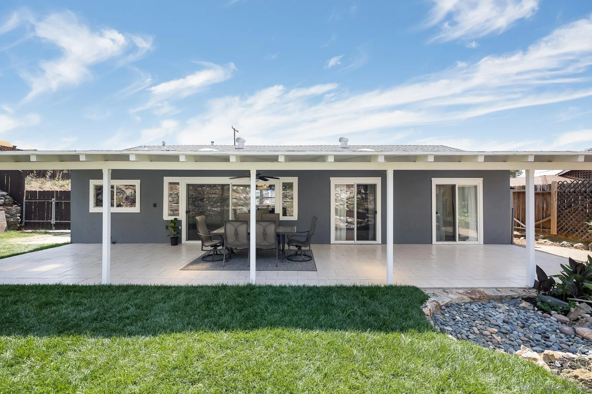 9731 Domer Road Santee, CA 92071 - Photo 26 of 32 a front view of house with a garden and patio