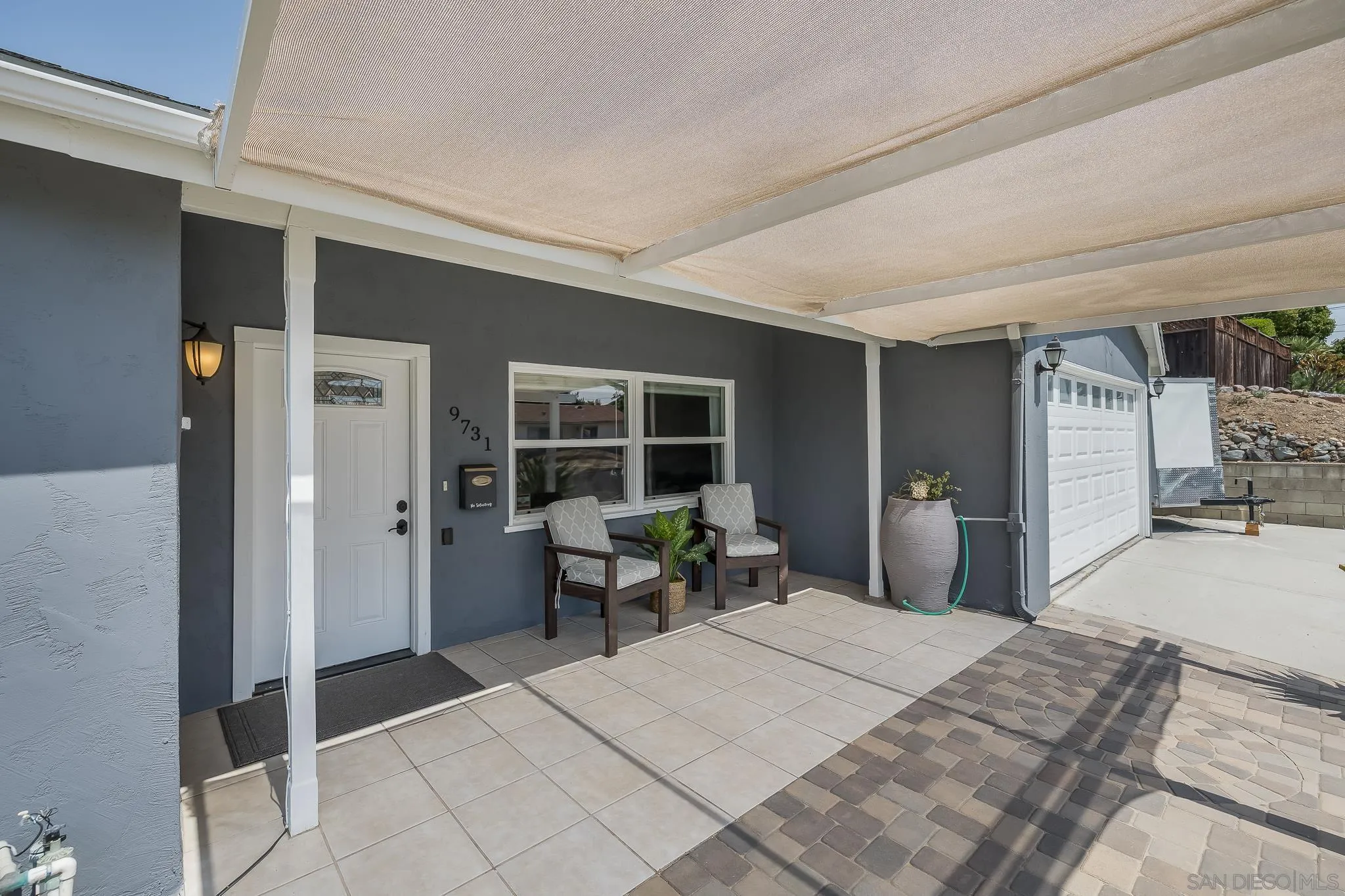 9731 Domer Road Santee, CA 92071 - Photo 5 of 32 a bedroom with a bed and wooden floor