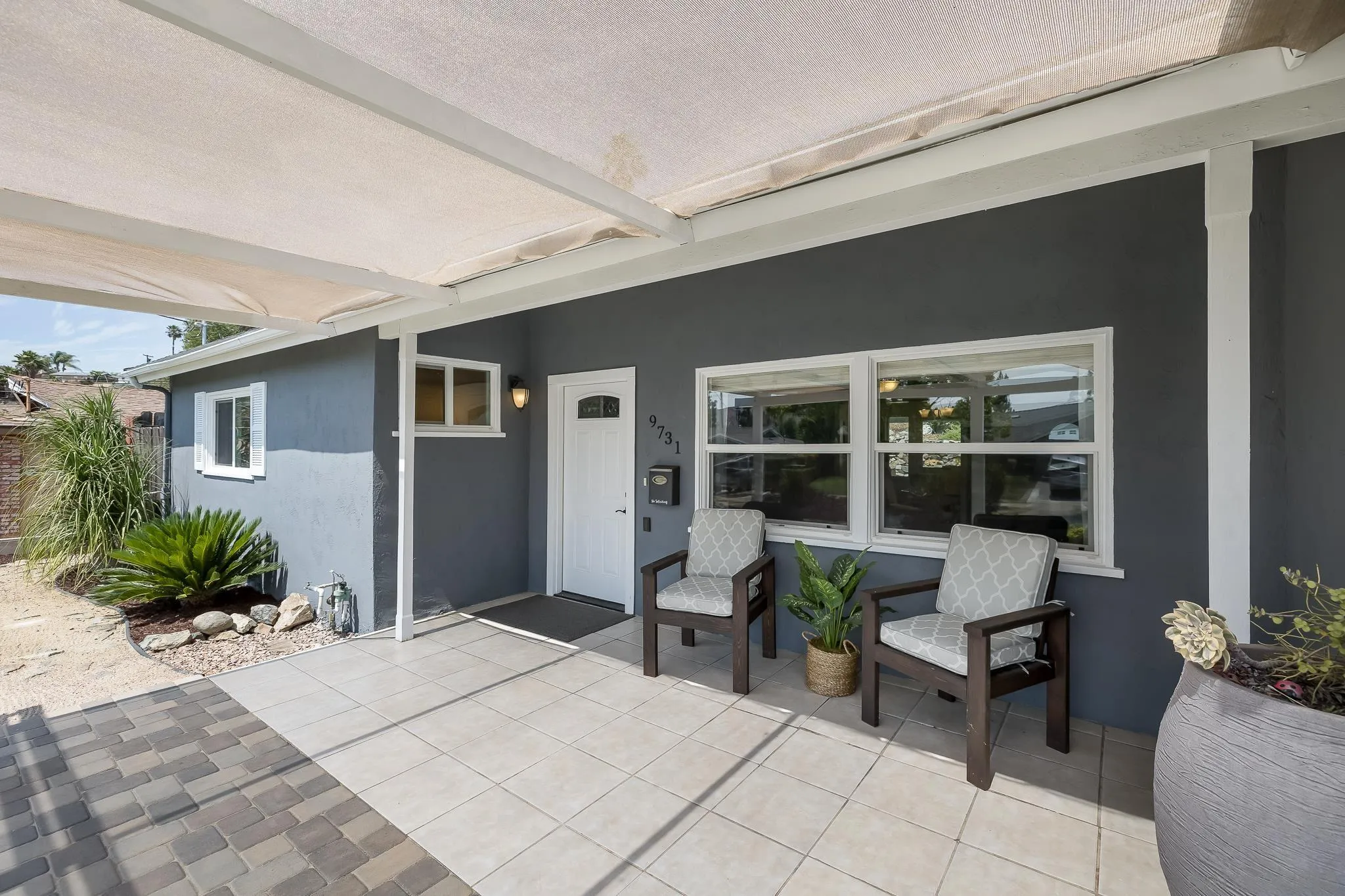 9731 Domer Road Santee, CA 92071 - Photo 6 of 32 a balcony with furniture and a potted plant