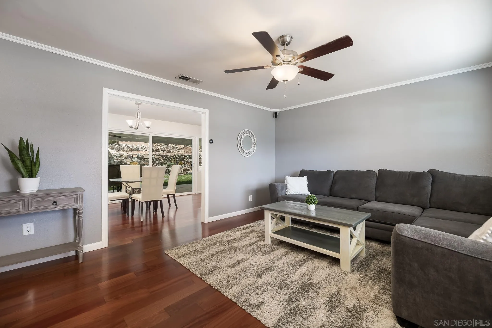 9731 Domer Road Santee, CA 92071 - Photo 7 of 32 a living room with furniture and a wooden floor