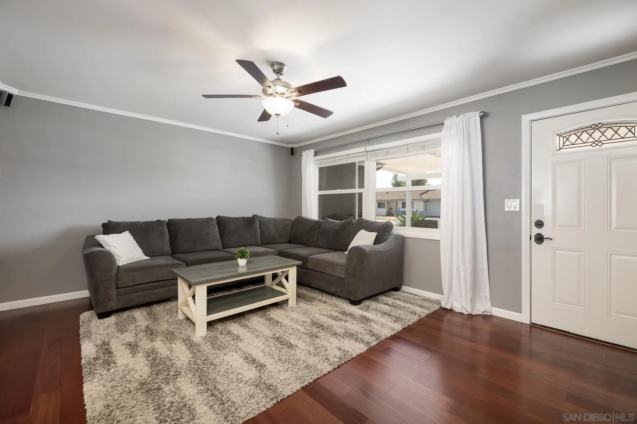 9731 Domer Road Santee, CA 92071 - Photo 8 of 32 a living room with furniture and a large window