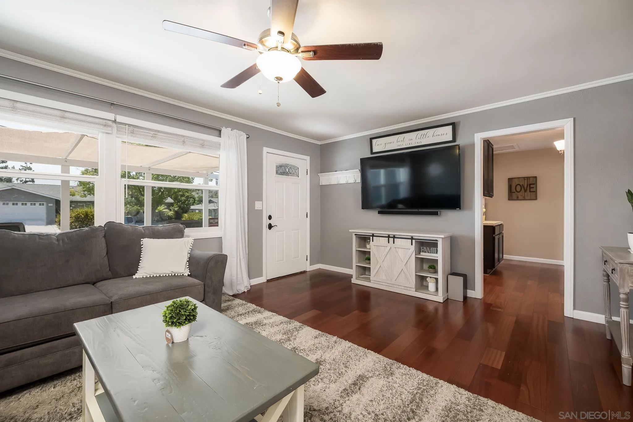 9731 Domer Road Santee, CA 92071 - Photo 9 of 32 a living room with furniture and a flat screen tv