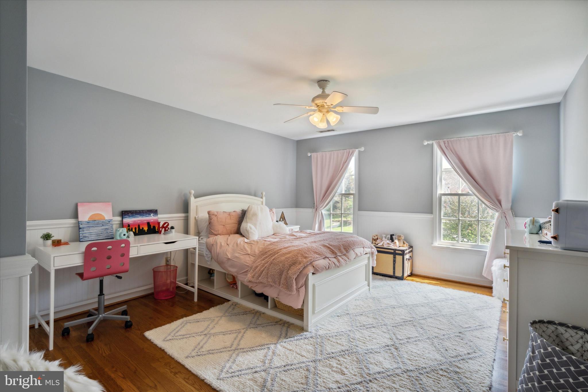 792 Avonwood Drive Wayne, PA 19087 - Photo 28 of 35 a spacious bedroom with a bed and a chandelier