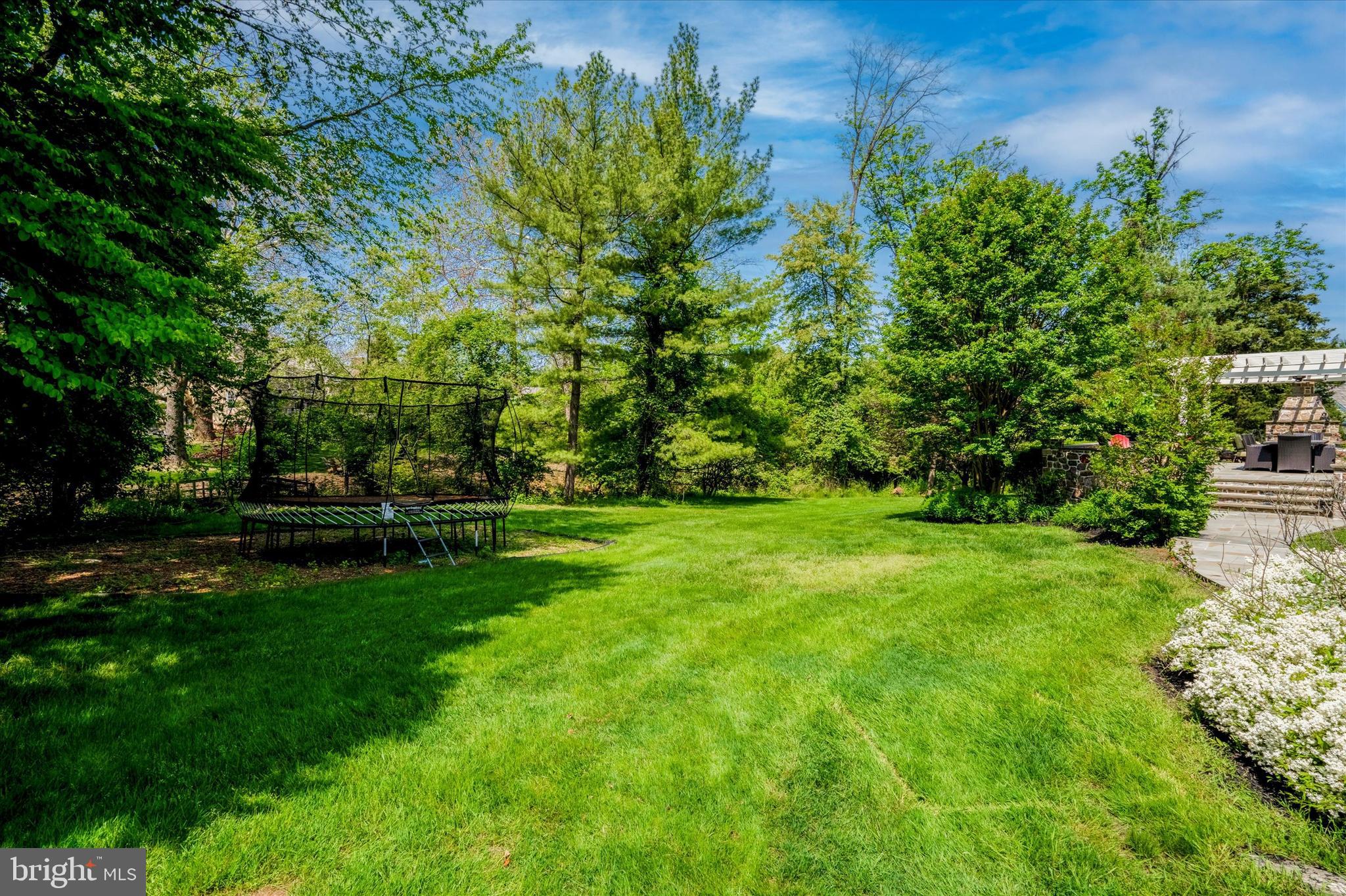 792 Avonwood Drive Wayne, PA 19087 - Photo 4 of 35 a view of a park with plants and a bench