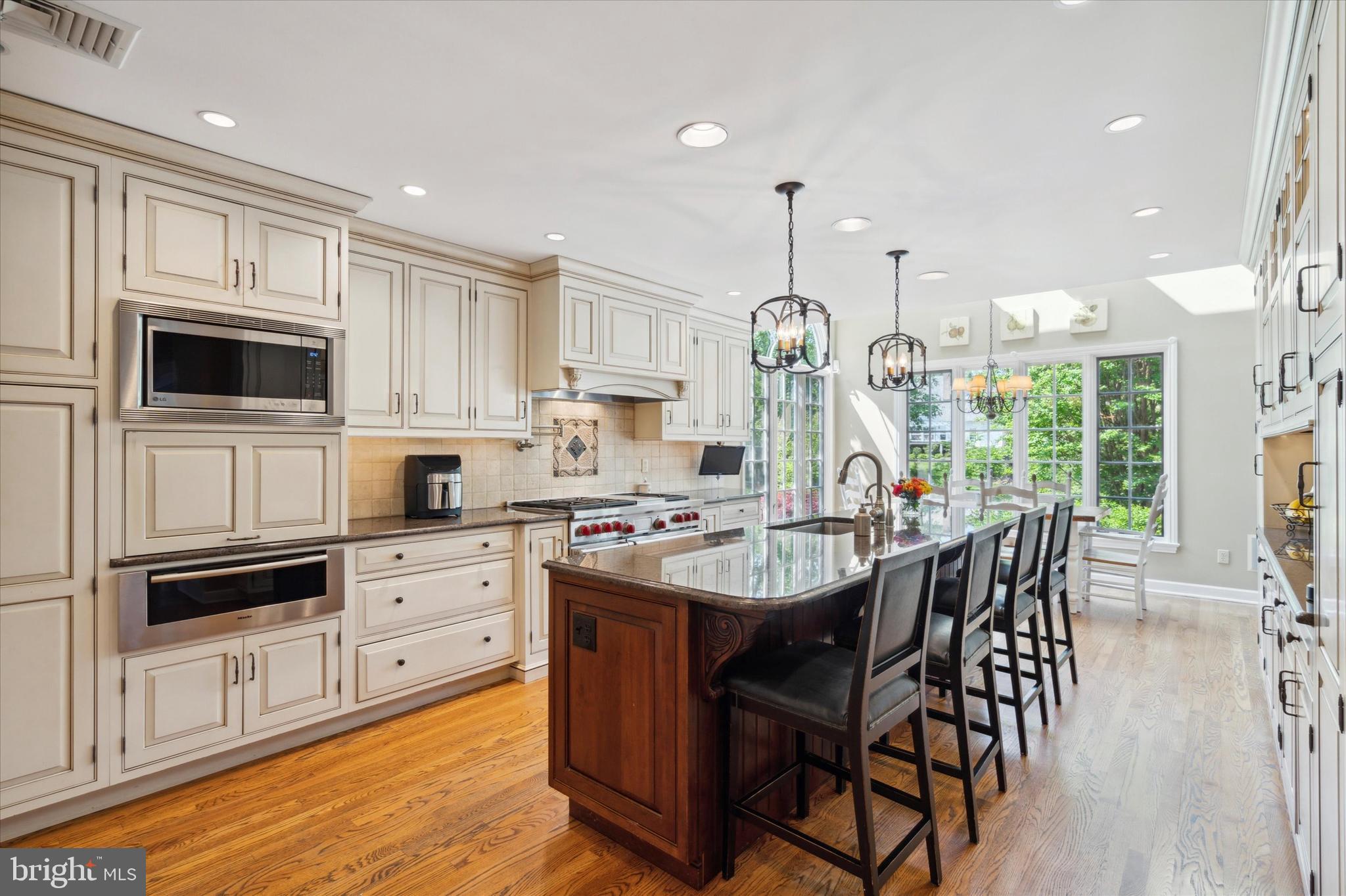 792 Avonwood Drive Wayne, PA 19087 - Photo 10 of 35 a large kitchen with kitchen island granite countertop lots of white cabinets appliances and furniture