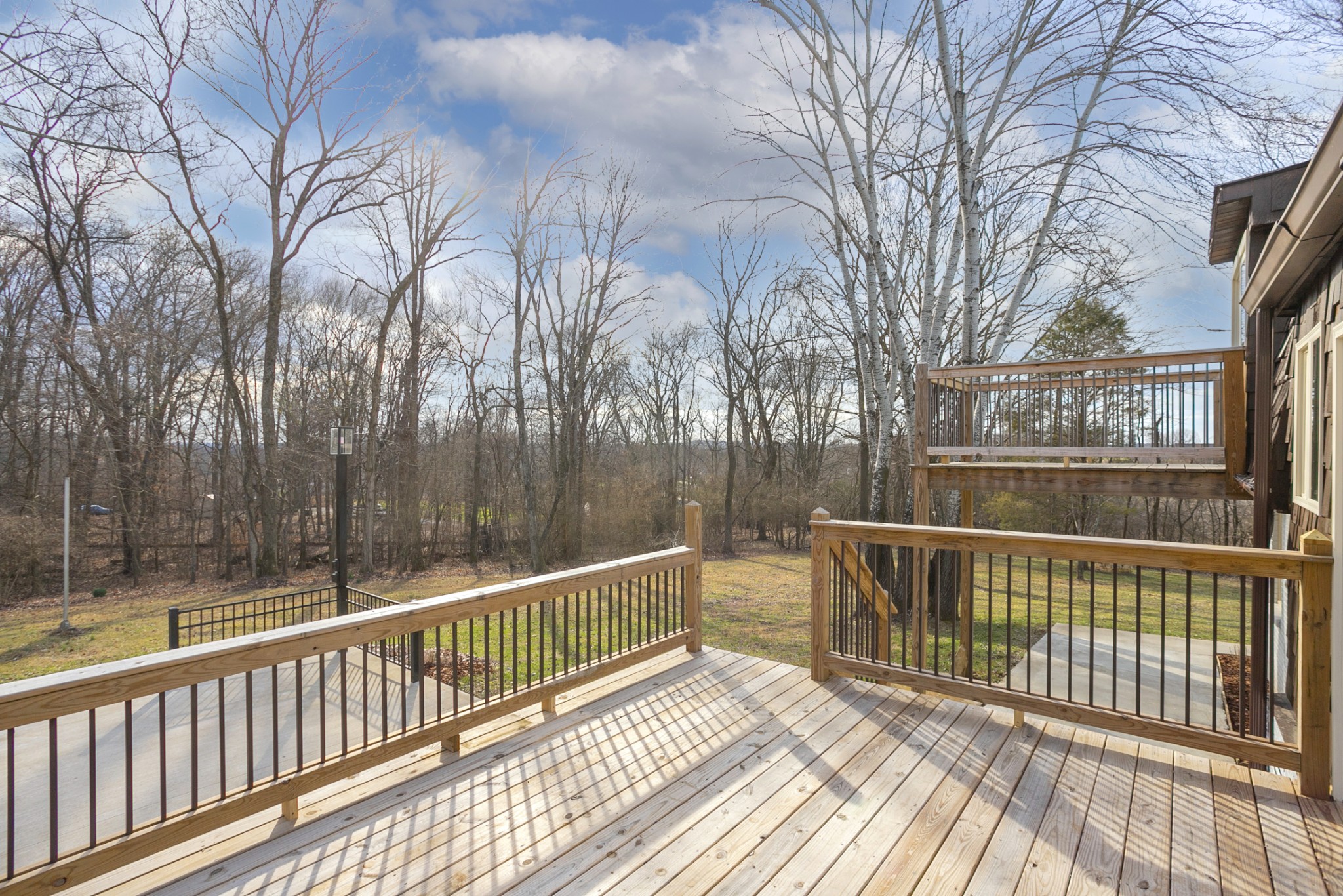 742 C Bates Road Lebanon, TN 37087 - Photo 11 of 59 a view of a balcony with wooden floor and fence